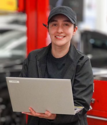 A female student in the auto tech lab